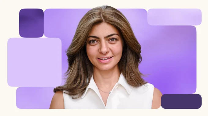 Rana el Kaliouby standing in front of purple background