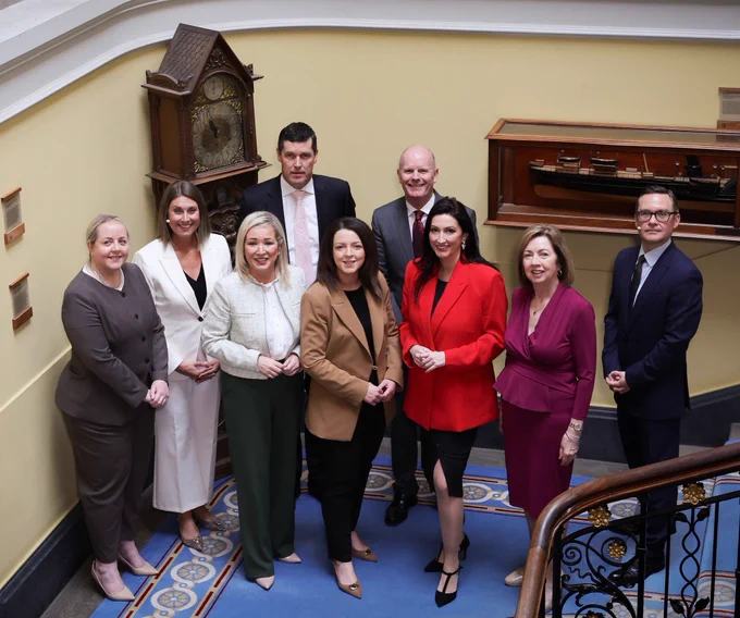 Image of nine people - including First Minister Michelle O’Neill, deputy First Minister Emma Little-Pengelly and Infrastructure Minister Liz Kimmins, pictured at Belfast Harbour Commissioner office
