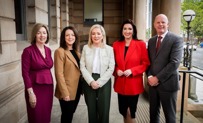 Image of five people - including First Minister Michelle O’Neill, deputy First Minister Emma Little-Pengelly and Infrastructure Minister Liz Kimmins pictured at Belfast Harbour Commissioner office
