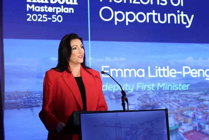 Image of one person, deputy First Minister Emma Little-Pengelly, behind lectern, addressing audience at launch of Belfast Harbour Masterplan