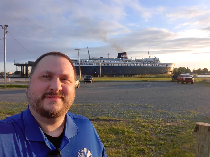 Community Engagement Librarian Adam Oster in Ludington with the SS Badger car ferry in the background.