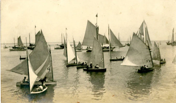 From the Harrison County Library System Local History & Genealogy Postcard Collection. Postcard depicting Gathering of sailboats, circa 1910s, 1920s.