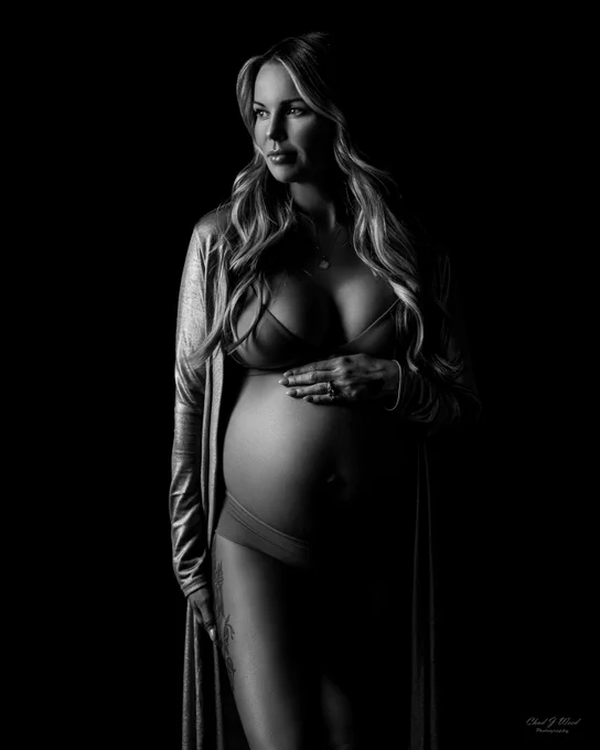 Artistic silhouette maternity photo captured in Phoenix studio.