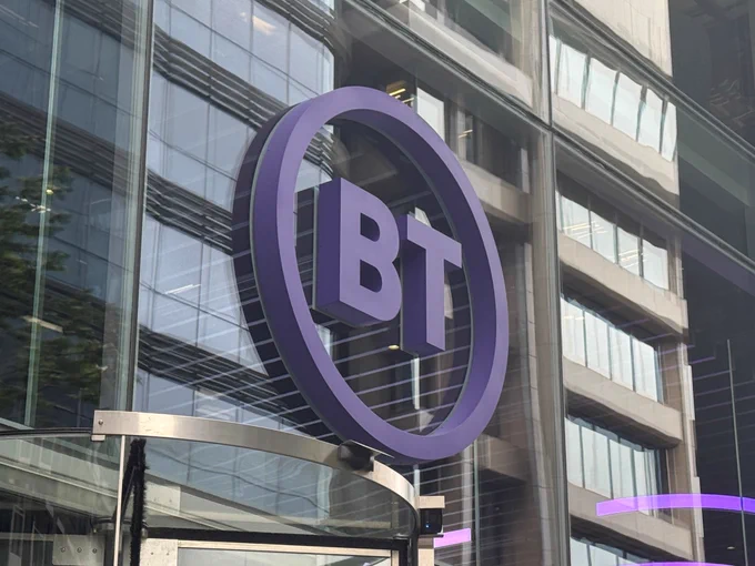 A BT Group logo on the side of a glass building