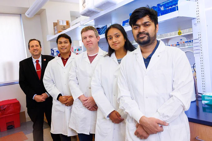 Eric Weaver and his research team in a lab