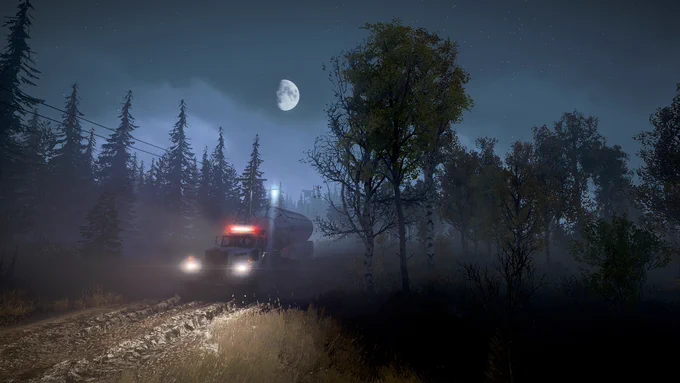A semi-truck with headlights on drives along a muddy forest road under a bright moonlit sky at night.