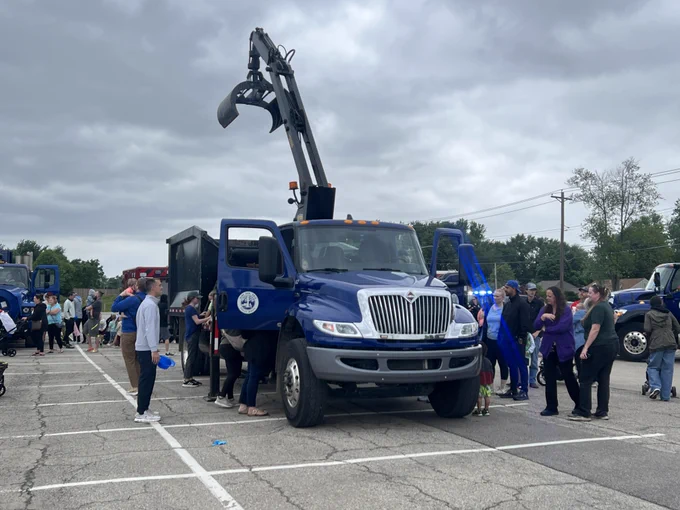 truck with people around it