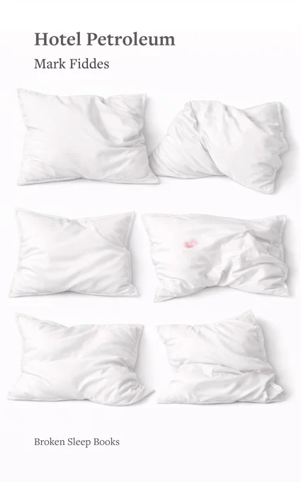 Book cover for Hotel Petroleum by Mark Fiddes, published by Broken Sleep Books. The background is white, with the title in bold dark grey serif type and the author name beneath it. Six white pillows are arranged in three rows of two across the cover, each slightly crumpled or creased; one pillow in the middle row bears a small pink stain. The overall effect is clinical and plain.