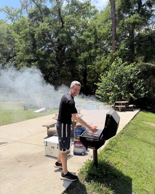 Mike Stukel cooking on a grill.