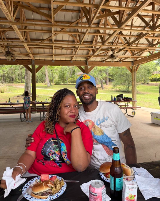 Two picnic attendees smiling.