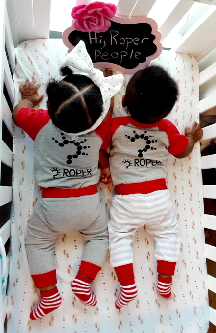 Twins wearing Roper onsies