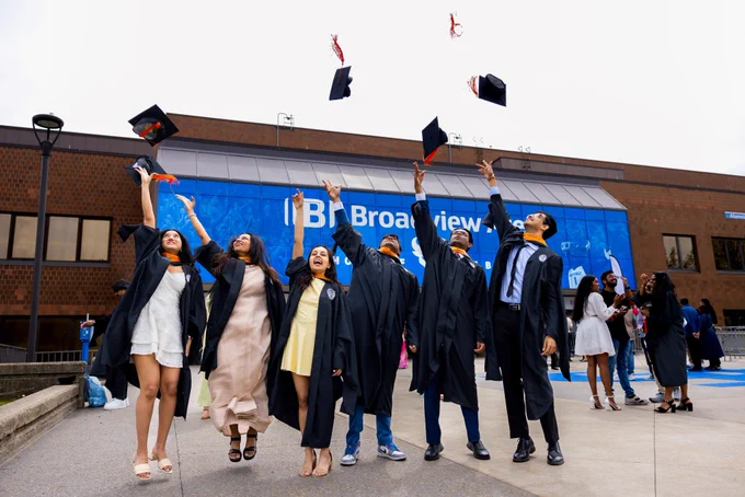 Graduates celebrate commencement outside Broadview Arena.