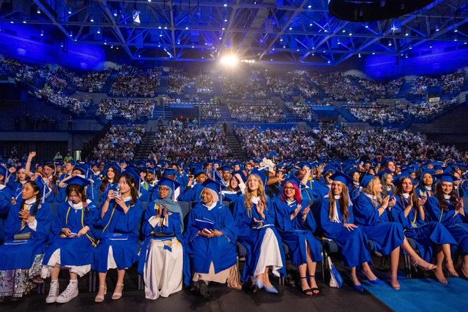 Graduates attend commencement at Broadview Arena.