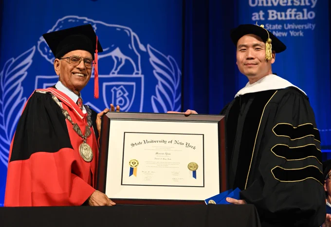 UB Alumnus Marcus Yam receives a SUNY Honorary Degree at the School of Engineering and Applied Sciences commencement. 