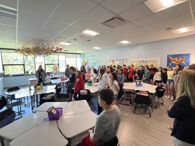 Students singing Country Road