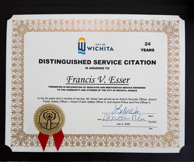 Certificate of Distinguished Service for 24 years awarded to Francis V Esser and signed by Mayor Lily Wu.