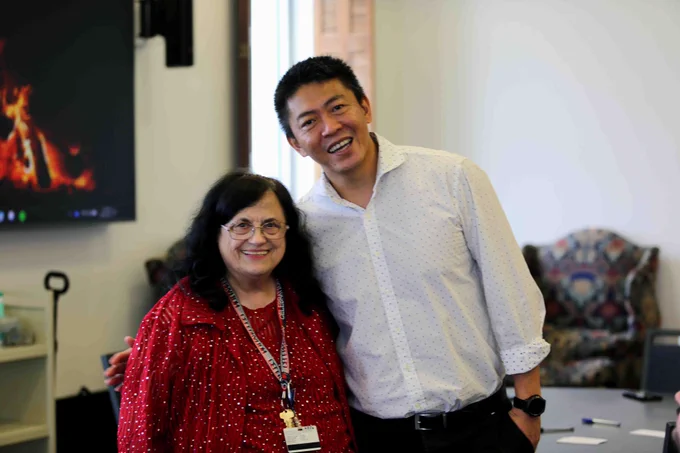 Pictured is a photo of Donna Kelley standing next to Dean of U T A Libraries John Wang.