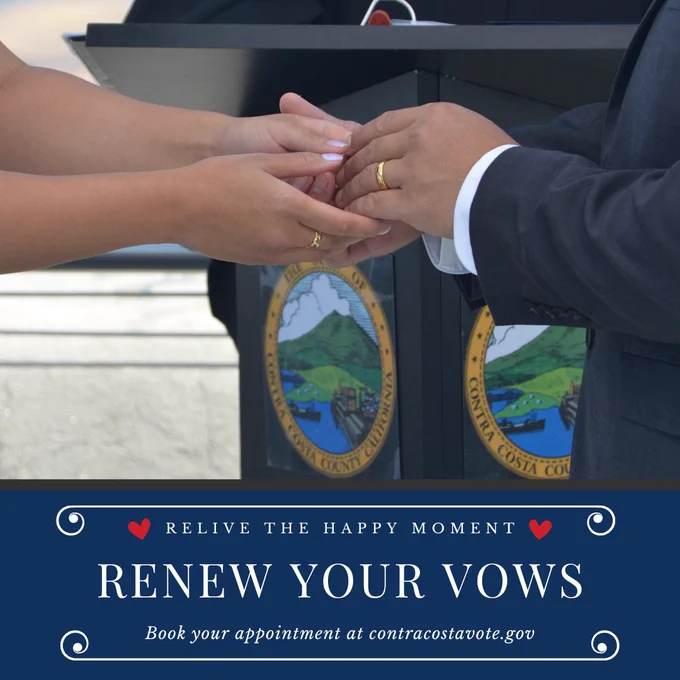 Close-up of a couple exchanging wedding rings during a vow renewal ceremony promoting renewing vows at the Clerk-Recorder's Office with the Contra Costa County Seal in the background.