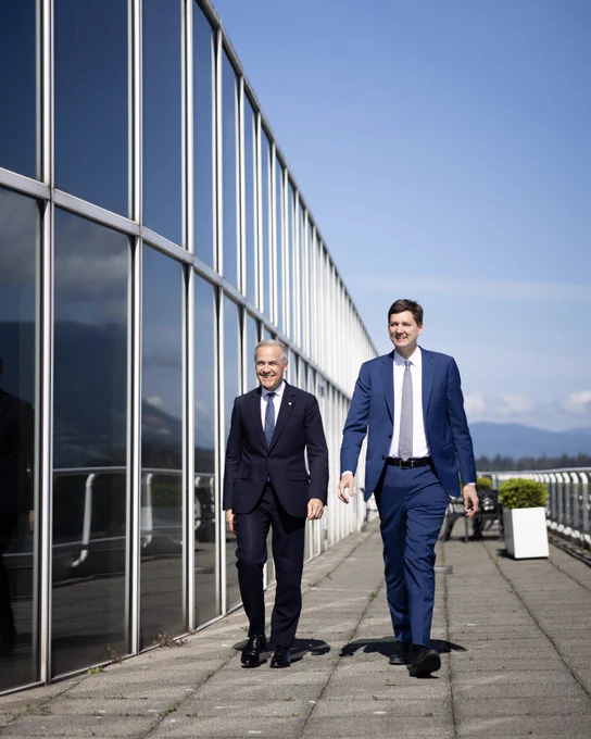 Prime Minister Carney and Premier Eby walk together in Vancouver, British Columbia.