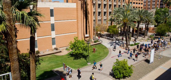 People move along Tyler Mall on Arizona State University's Tempe campus.