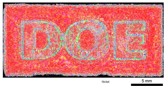 This high-resolution microstructural map of a nickel sample demonstrates how researchers can precisely control metal grain structure during additive manufacturing, with the patterned DOE region revealing engineered variations in grain orientation and structure at the millimeter scale. Credit: ORNL, U.S. Dept. of Energy