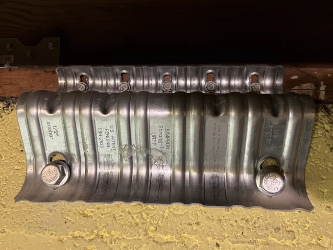 This is a universal retrofit foundation plate that bolts a house’s foundation to the sill plate, which can help reduce damage to an older home during an earthquake.