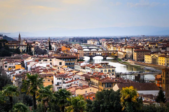 Explore Florence's iconic landmarks and picturesque landscape from a bird's eye perspective.