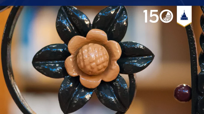 A decorative rosette on one of the Library’s wrought iron balustrades.