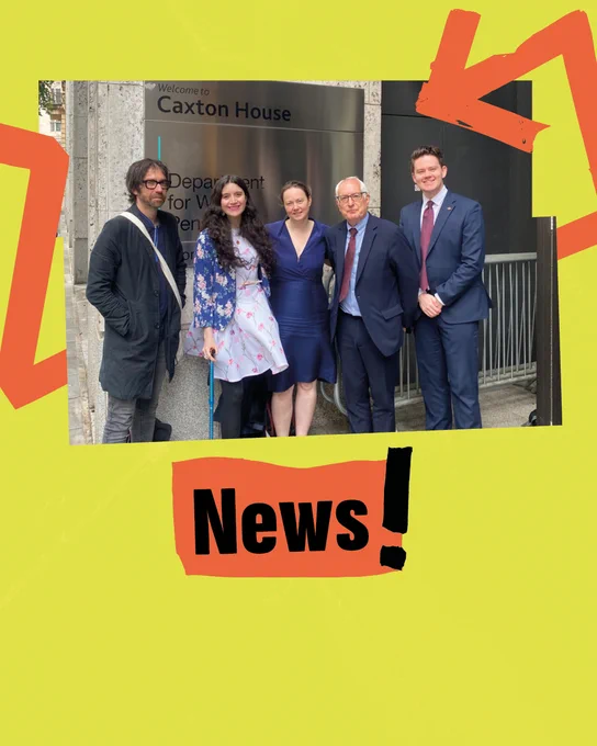 Graphic with a photo of five people standing in front of the Department of Work and Pensions at Caxton House in London. The image is in a jagged frame on a bright yellow background. Orange arrows are wrapped around it. Bold black text on orange tape below reads “News!”