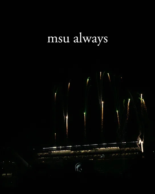 Night scene with \"msu always\" text above Spartan stadium outlined with lights, with fireworks in green and gold above it. The Michigan State Spartan logo is visible at the bottom of the stadium.
