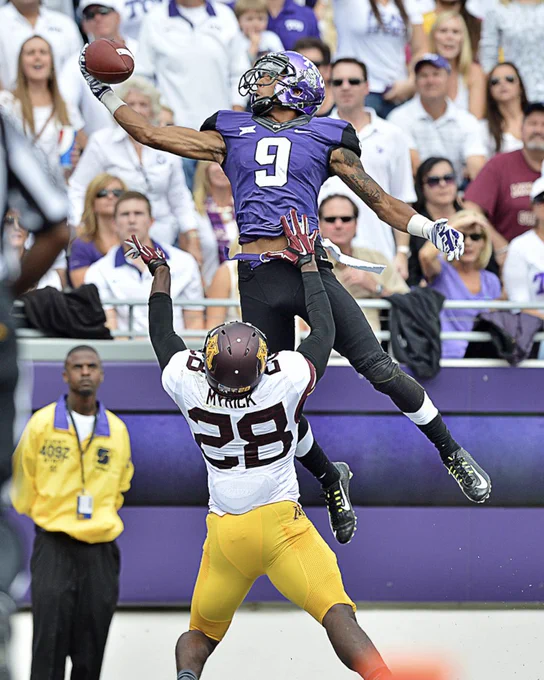 TCU receiver Josh Doctson (9) stretching to catch a ball over Minnesota defensive back Jalen Myrick (5) in 2014