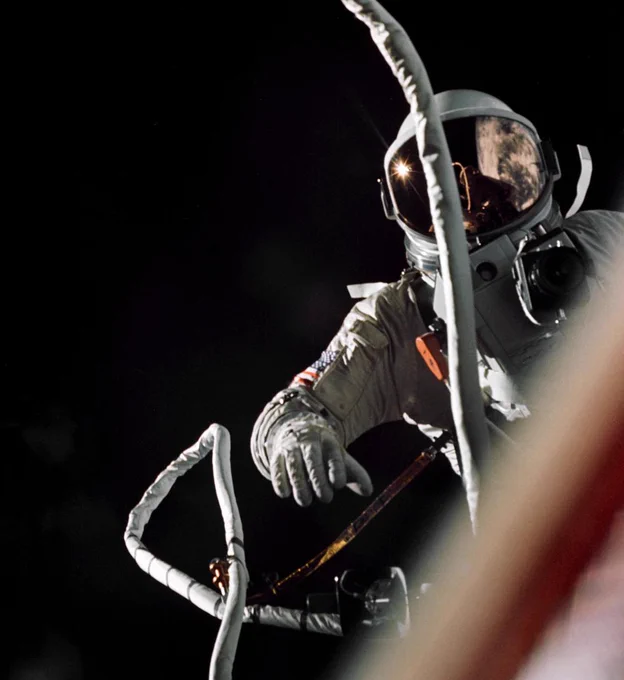 Gemini IX-A astronaut Gene Cernan is backdropped by the blackness of space during America’s second spacewalk on June 5, 1966. His umbilical floats in the foreground, partially obscuring the view of the astronaut. Credit: NASA/Tom Stafford
