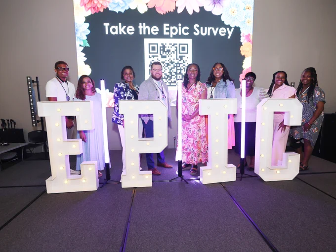 EPIC team from Eastwood Middle stand behind EPIC sign!