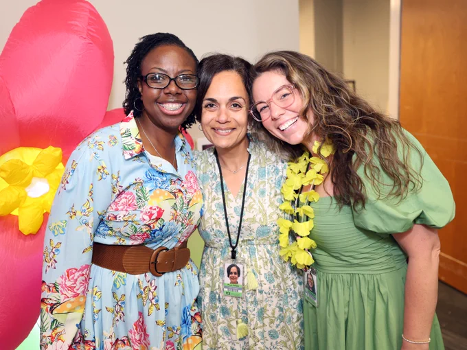 Three educators pose for photo.