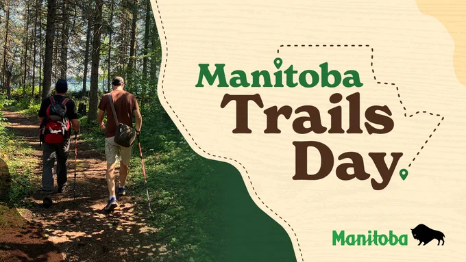 Photo of two people hiking through a trail in the woods in the summer. Caption: Manitoba Trails Day.