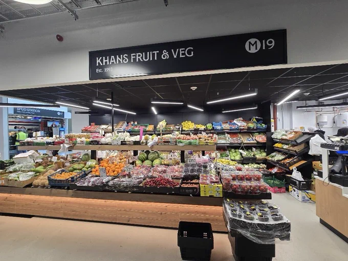 A well stocked fruit and veg stall on Oldham Market