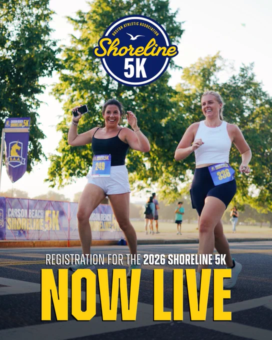 Image of two (2) participants of the 2025 Carson Beach Shoreline 5K smiling while crossing the finish line with the 2026 event logo overlayed at the top center and text overlayed at the bottom center that reads: “REGISTRATION FOR THE 2026 SHORELINE 5K NOW LIVE”