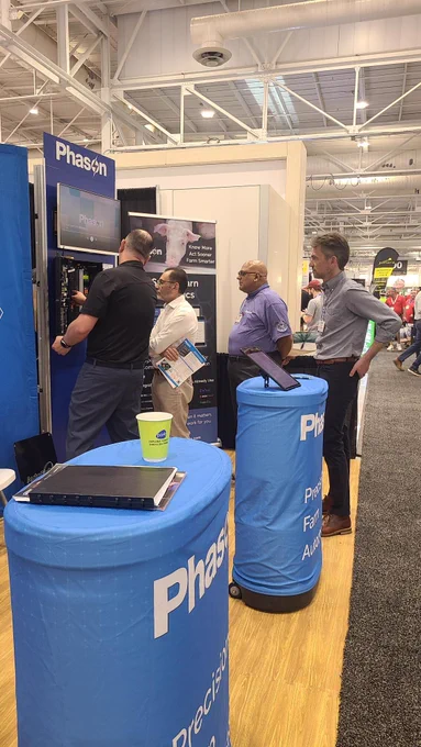 Phason Controls representatives demonstrate the AutoFlex Connect barn automation system to attendees at World Pork Expo 2026.