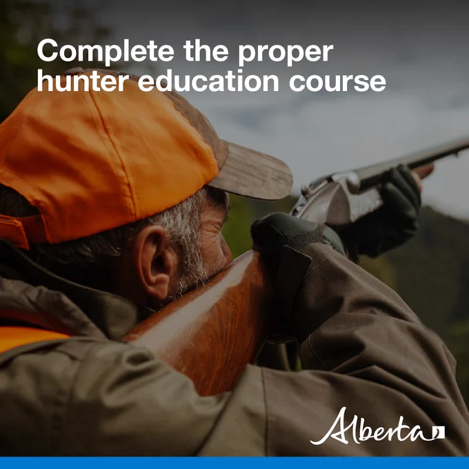 image depicts a hunter peering down the sights of a shotgun. Text reads Complete the proper hunter education course with the white Alberta logo in the bottom right corner.