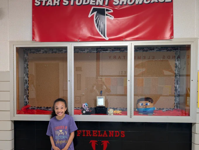 Student in front of display 