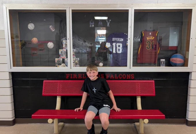 Student in front of display 