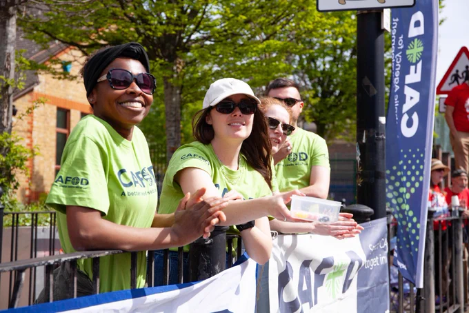 A volunteer stood at the CAFOD cheer station by the London Marathon. 