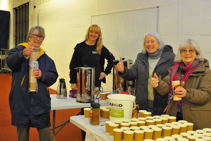 A group of volunteers by a drinks station at the Liverpool Fun Run. 