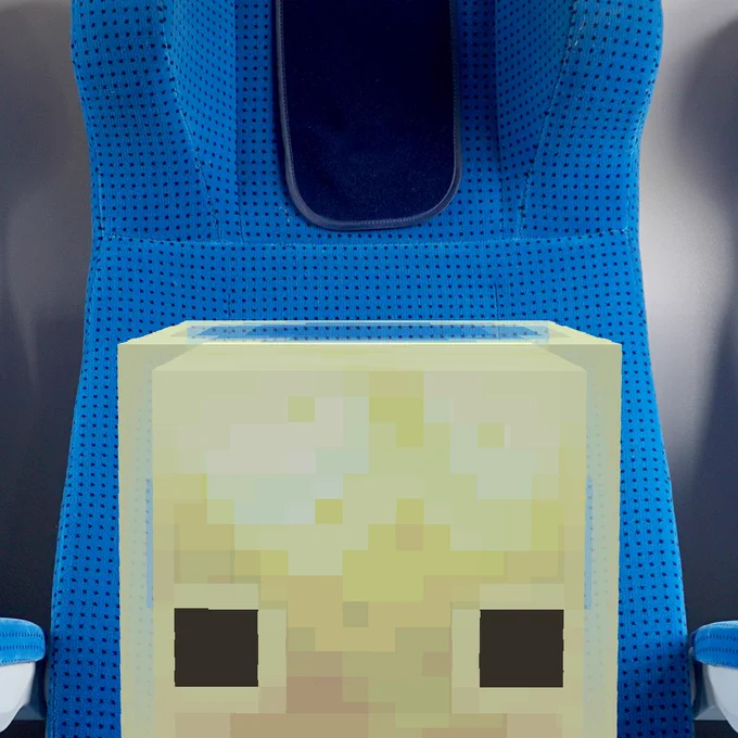 A sulfur cube sitting in an airline seat