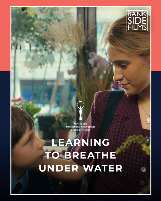 A photo of an adult and a child looking at each other warmly, framed by a red and blue border. In the top right corner is a logo for Bankside Films. In the middle of the image is a logo for Karlovy Vary International Film Festival. Below this is larger text, reading: Learning to Breathe Under Water
