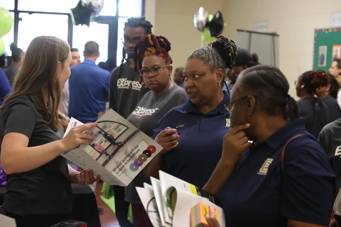 School custodians receiving information from vendor.