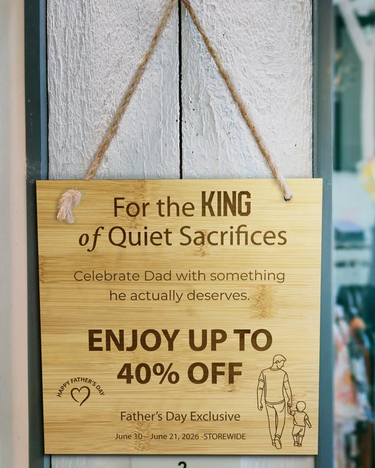 Custom Bamboo Sign Laser Engraved With Fathers Day Message And Artwork And Discount Details Mounted On Wall Via Twine