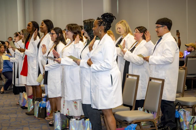 The RSC MLT Class of 2026 takes their oath wearing their white coats.