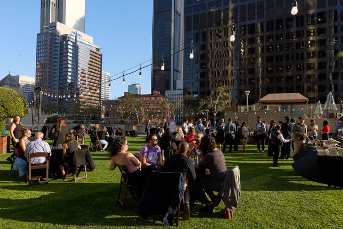 An outdoor gathering on a rooftop in LA during the Federal Deployments Convening. 