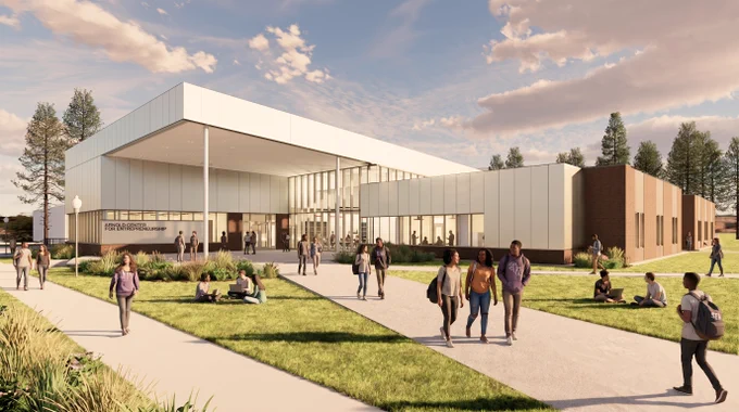 Architectural rendering of the Arnold Center for Entrepreneurship facility with large windows and a sleek design sits under a partly cloudy sky. Groups of people are walking and sitting on the grass in front, enjoying the sunny day.